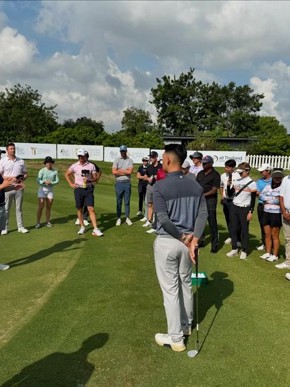 A group of coaches, including mine, listen to short game expert Alex Buckner. Exposing my team to different coaching philosophies and techniques is crucial for our collective growth.