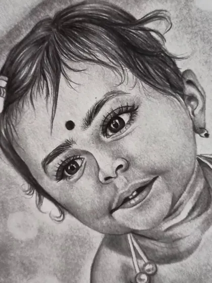 A close-up detail from another baby portrait, focusing on the eyes, which are full of life and curiosity. The bindi is a lovely traditional touch.