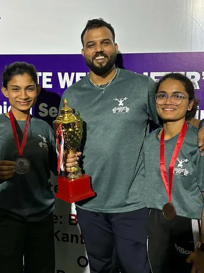 Posing with two of our medal winning athletes at the 2023 state championships. Coaching them to this level of success is my greatest reward.