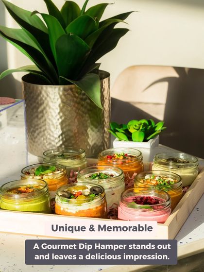 A gourmet dip hamper is a unique and memorable gift that stands out from the usual. This tray showcases the vibrant colours of our various dips, promising a delicious impression.