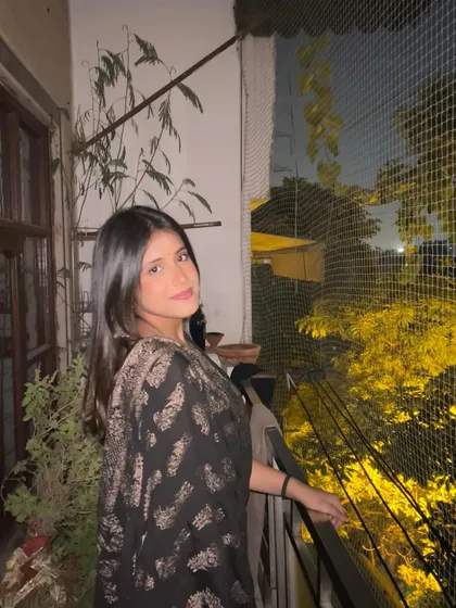 On a balcony at night. The quiet of the evening is often when I feel most creative and write my best lyrics.