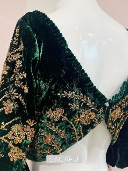 The back view of our green velvet blouse, showing how the gold zardosi embroidery continues seamlessly for a complete, luxurious look.