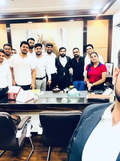 A selfie capturing the happy moment of a team celebration. We believe that a positive and supportive office environment translates into better results for our clients.