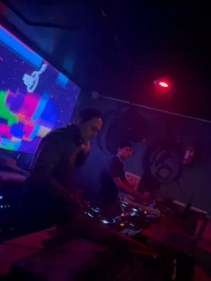 A shot of me and my fellow DJ working together during a Casino Royale theme night.