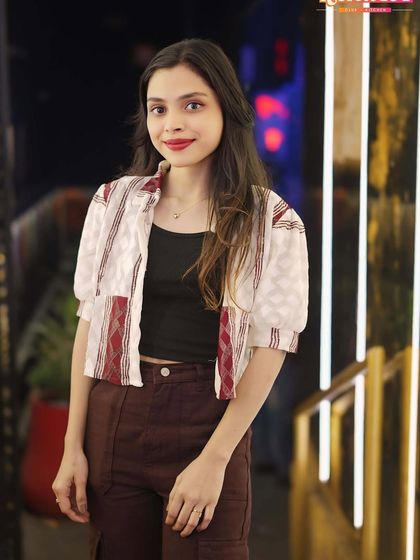 A guest posing by the entrance, showcasing the venue's unique decor.