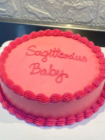 A different view of the pretty pink "Sagittarius Baby" cake.