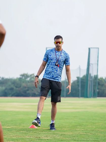 Demonstrating a drill for the players. I lead by example, showing them the standard I expect.