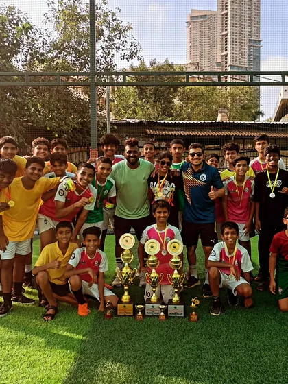 Independence Cup Champions! Our U-13 and U-15 teams celebrating together with their trophies, a moment of immense pride for the entire SoccerStarzz family.