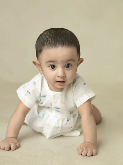 A collection of simple, classic portraits of twin babies. Without props or themes, their individual expressions and connection are beautifully highlighted.