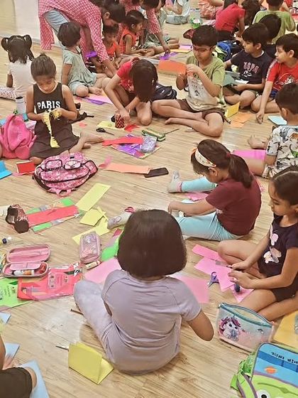 A snapshot of our art and craft session in full swing. The studio floor becomes a canvas of creativity, with everyone busy making their own masterpieces.