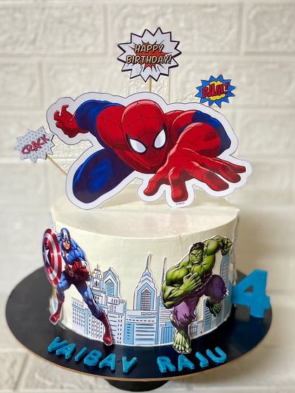 A superhero mashup. This chocolate cake for a 4th birthday features Spiderman, Captain America, and the Hulk.