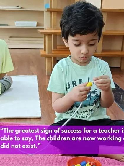 "The children are now working as if I did not exist." This quote from Dr. Montessori is the ultimate goal. This image of a child independently engaged in a threading activity perfectly illustrates a classroom where the teacher has successfully prepared the environment and can now step back and observe.