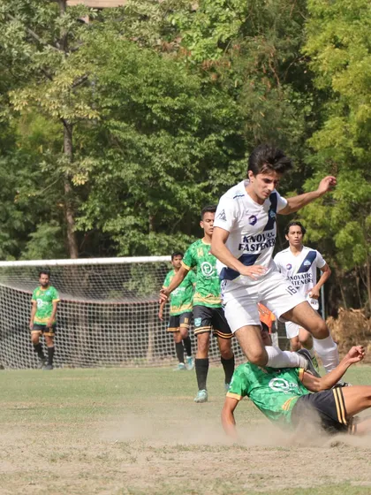 An action shot of a player executing a sliding tackle, capturing the grit and determination we expect from every Wolf.