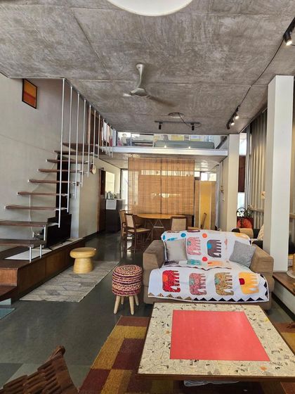 (Duplicate of 29) The double-height volume of my home-studio creates a sense of generosity and space, even on a small urban plot. The mezzanine level overlooks the main living area, maintaining a sense of connection between floors.