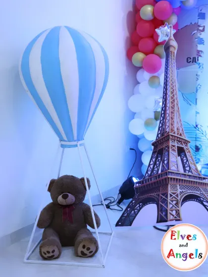 The large hot air balloon prop with a teddy bear pilot is a favorite for photos.