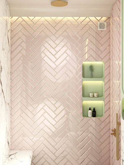 A detail shot of the pink herringbone tile in the kids' bathroom shower. The texture and color add a soft, playful element to the space.