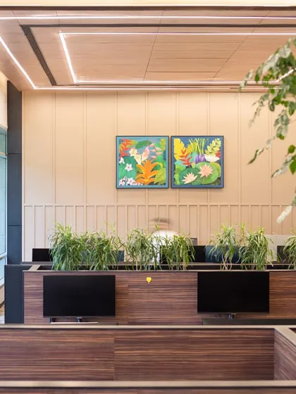 Workstations integrated with planters and biophilic elements. This design not only improves air quality but also brings a sense of tranquility and natural beauty into the workspace.