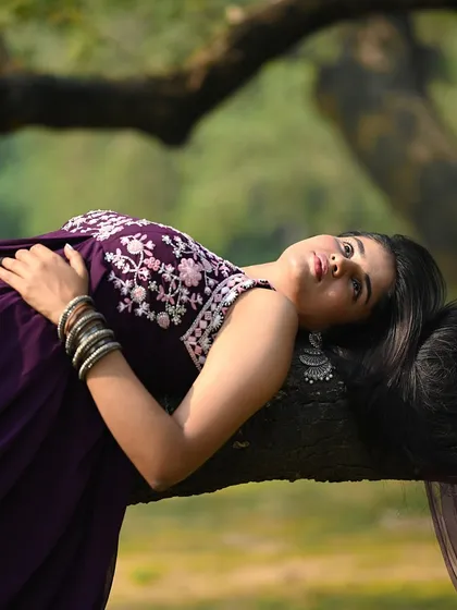 A beautiful portrait of the model waking up in her natural, fairy-tale-like setting.