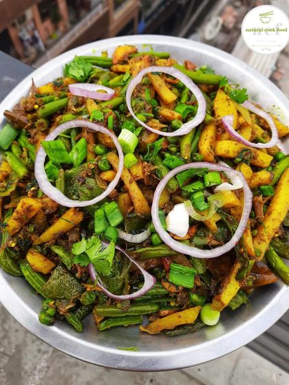 Kanghou, a popular savory stir-fried side dish in Manipur, made with a mix of fresh vegetables.