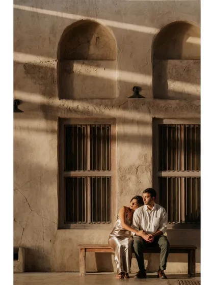 A quiet moment captured in the historic Al Fahidi district of Dubai. The beautiful play of light and shadow on the traditional architecture adds a timeless quality to this engagement photo.
