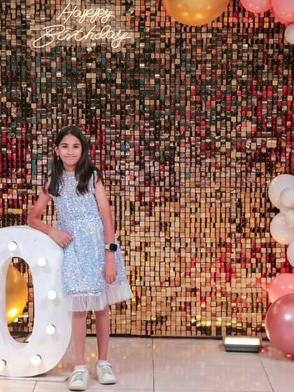 A thrilling 'Hot Wheels' themed birthday party, with checkered flags, car cutouts, and a custom racetrack backdrop, perfect for little speed enthusiasts.