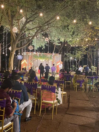 An enchanting outdoor wedding reception we catered at the Ecumenical Christian Center. We work with you to create a magical atmosphere with beautiful lighting and elegant seating that complements our delicious food.