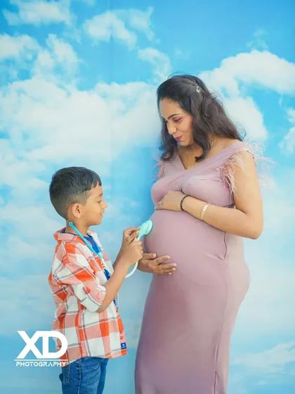 Big brother is ready for his new role. Using creative props like this toy stethoscope adds a playful and heartwarming touch to your family maternity session, telling a unique story about your growing family.