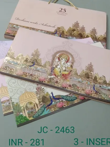 Announce your wedding with blessings using this grand invitation set featuring Lord Ganesha. The card comes with multiple inserts for different functions and a matching carry bag, making it a complete and auspicious package.