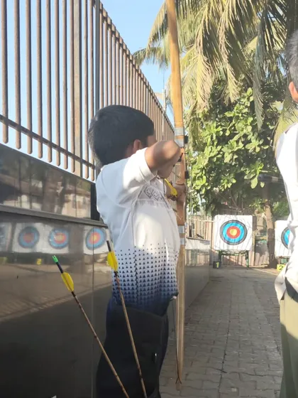 A young boy in his shooting stance. We teach the fundamentals of posture and alignment to ensure a strong, repeatable shot.