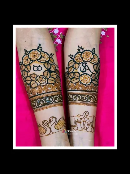 The full arm design, combining the floral wreaths with graceful swans and elephants, adding a touch of traditional elegance to the modern theme.