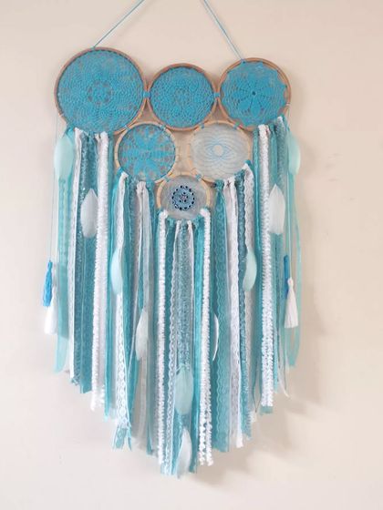 Blue is a calming and serene color. This new cluster dreamcatcher design in our most loved color is perfect for creating a tranquil backdrop in any space.
