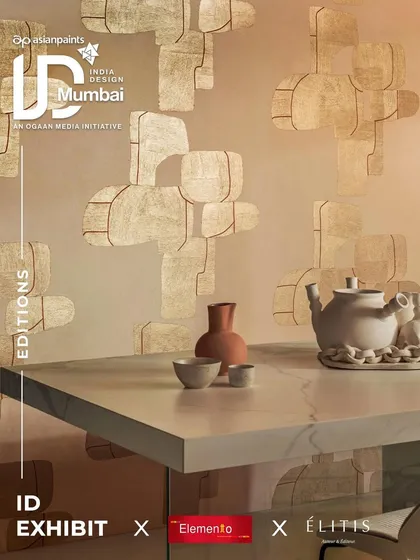 This Élitis wallpaper from the 'ID Exhibit' collection uses geometric shapes and a warm, earthy palette to create a sense of modern artistry. It serves as a sophisticated backdrop for a minimalist dining setup, adding texture and visual interest.