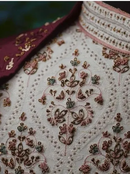 It's all in the details. This is a close-up of the fine threadwork and sequin embroidery on one of my designer sherwanis. I focus on quality craftsmanship so you look your absolute best on your big day.