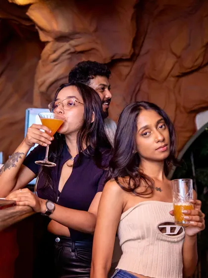 Guests enjoying their drinks at the bar during a JU:CY night. The atmosphere is always buzzing.