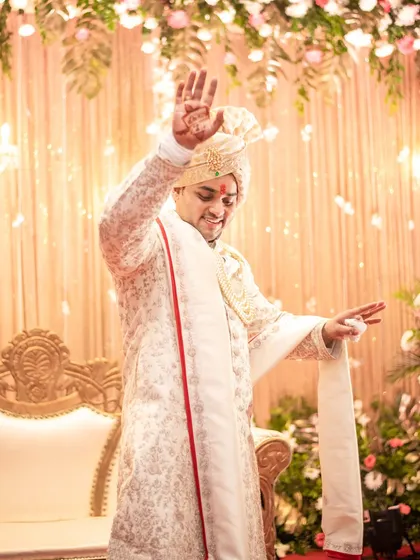The groom's happy dance! We love capturing the groom's personality and joy, and this candid shot is full of energy and celebration.
