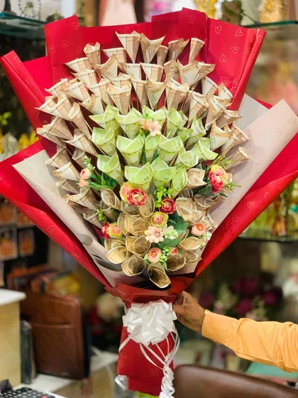 For a truly impressive and practical gift, I design these money bouquets using real Indian currency notes. Each note is carefully folded into a floral shape, creating a stunning arrangement that's very popular for weddings and milestone birthdays.