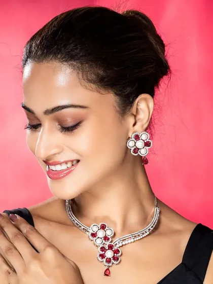 A close-up studio shot of a model wearing a floral-design diamond necklace, demonstrating our precision in capturing the fine details and sparkle of luxury jewellery.