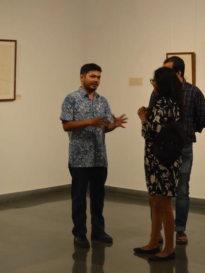 Artist Mohit Mahato in conversation with visitors during his exhibition preview. I encourage artists to be present and share the stories behind their work directly with the audience.
