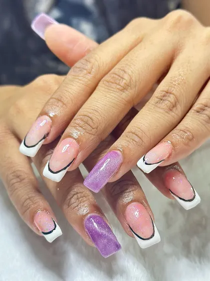 This trendy design features a sharp, graphic French tip outlined in black. A pop of purple cat-eye gel on the accent nail adds a surprising and cool element.
