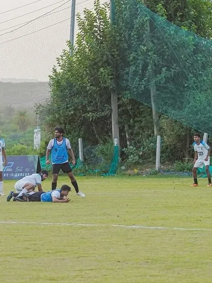 A scramble in the box during a league game. Our players fighting hard to defend and clear the ball.