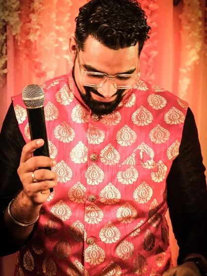 A candid moment with my microphone, which is more like a magic wand for creating fun. I love getting up close with the audience to make the experience more personal and engaging.