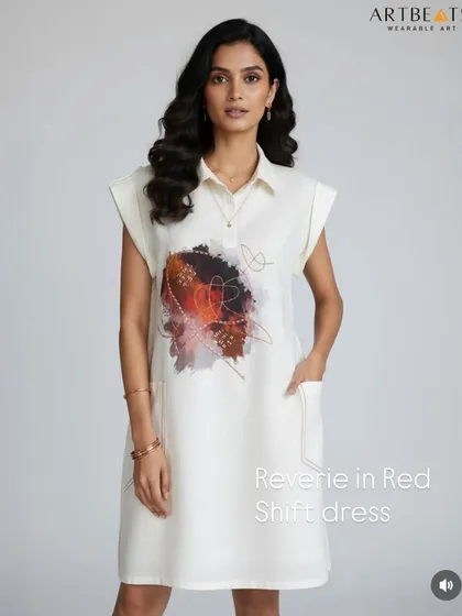 A full-length view of the Reverie in Red shift dress. The relaxed silhouette and cap sleeves make it an effortlessly chic piece, while the artwork provides a focal point of color and emotion.