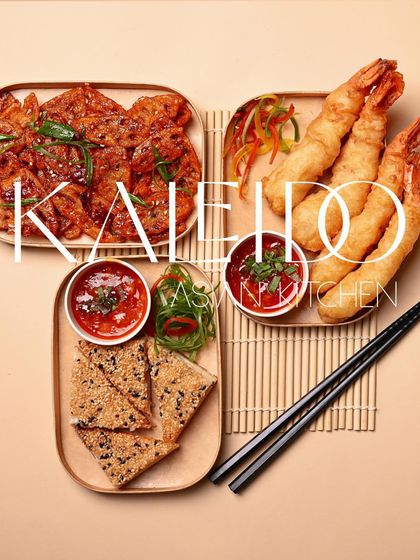 A platter showcasing a trio of our most popular appetizers. It features prawn tempura, sesame prawn toast, and another savory fried starter, perfect for sharing.