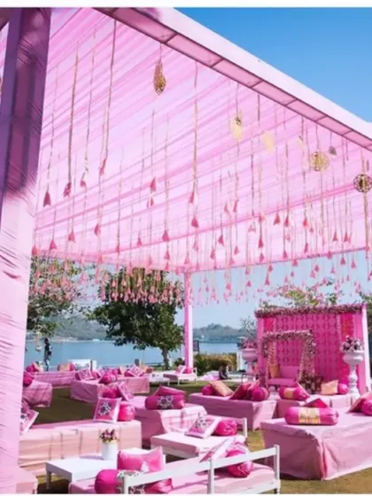 This lakeside event shows my ability to work with a monochromatic color scheme. The shades of pink in the canopy, seating, and floral details create a soft, romantic, and modern look for a daytime function.