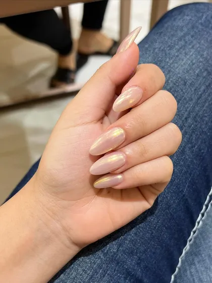 The way the light catches this iridescent polish is just beautiful. It's a simple way to make your nails look extra special.