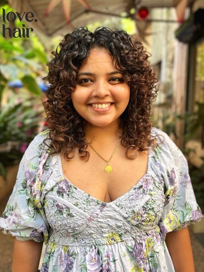 A soft, beautiful curly bob with subtle layers. This cut is perfect for adding volume and shape while keeping a classic, feminine look.