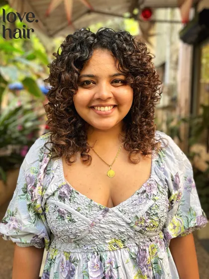 A soft, beautiful curly bob with subtle layers. This cut is perfect for adding volume and shape while keeping a classic, feminine look.