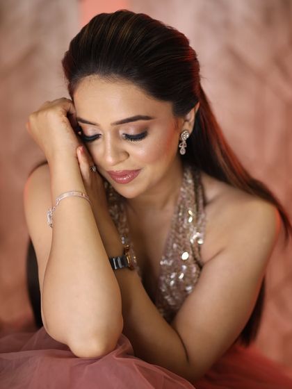 A soft and dreamy close-up. The makeup is blended to perfection, creating a flawless and ethereal look.