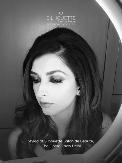 A timeless black and white shot of Aishwarya Jha after her hair and makeup session, capturing a moment of classic glamour.