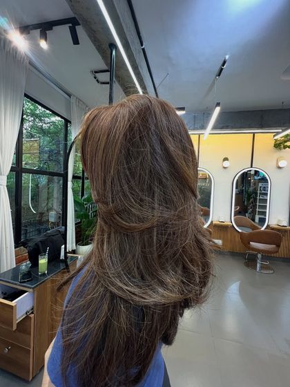 A different shade of brown, this time with a layered cut that adds volume and movement.